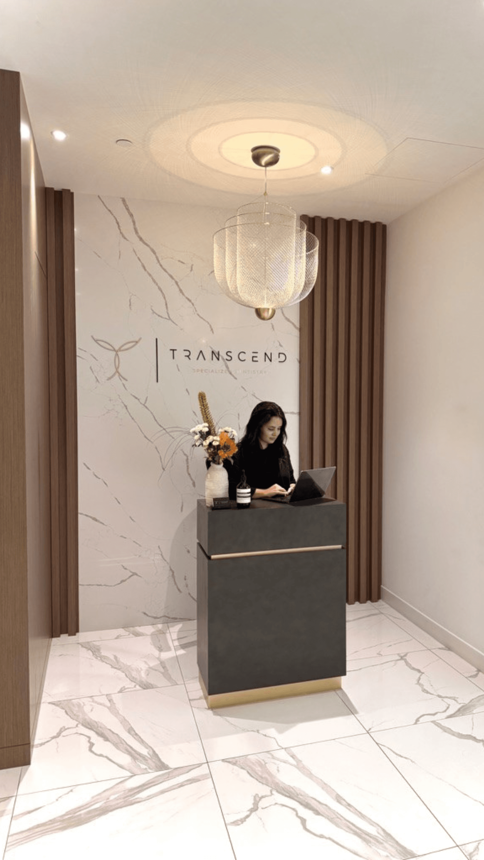 Team member at the reception desk at Transcend Specialized Dentistry Vancouver